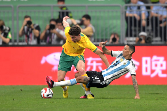 Jordan Bos negotiates his way past Angel Di Maria on Thursday night.