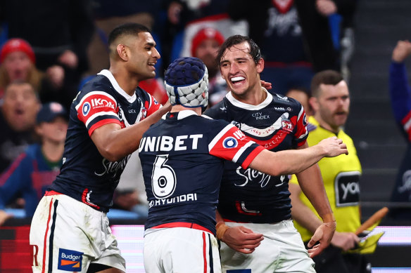 Roosters centre Billy Smith (right) celebrates his try on Saturday night.