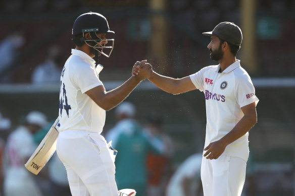 Hanuma Vihari shakes hands with his captain Ajinkya Rahane at stumps.