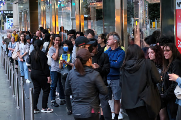 Boxing Day shoppers wait outside Myer’s Melbourne store for the chance to grab a bargain.