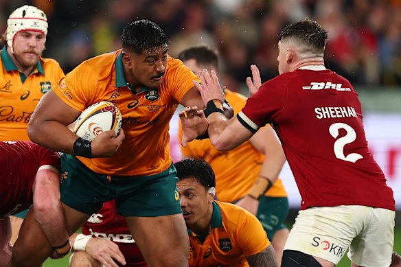 Will Skelton of the Wallabies evades a tackle.