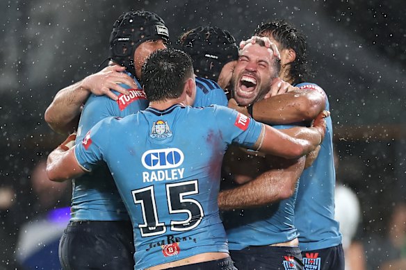 James Tedesco celebrates the match-winning try.