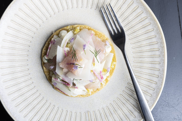 Tuna tostada with buttered leeks and pickled daikon.