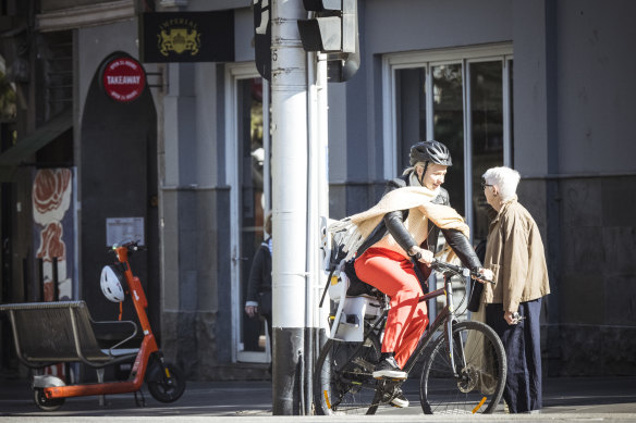 A cyclist at the corner of Bourke and Spring streets.