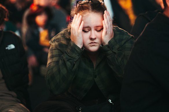 Fans react to the Matildas losing the match, at live site in Tumbalong Park, Darling Harbour.