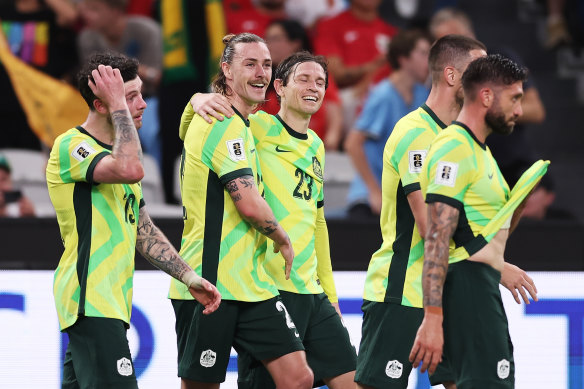 Jackson Irvine celebrates with teammates.