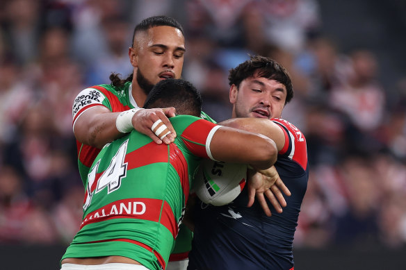 Roosters hooker Brandon Smith is taken down by the Rabbitohs defence.