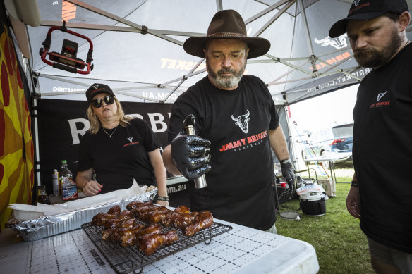 Liza Cameron, Jim Cameron (centre) and Nick Gutterson compete as the Jimmy Brisket team at Meatstock in Bendigo.