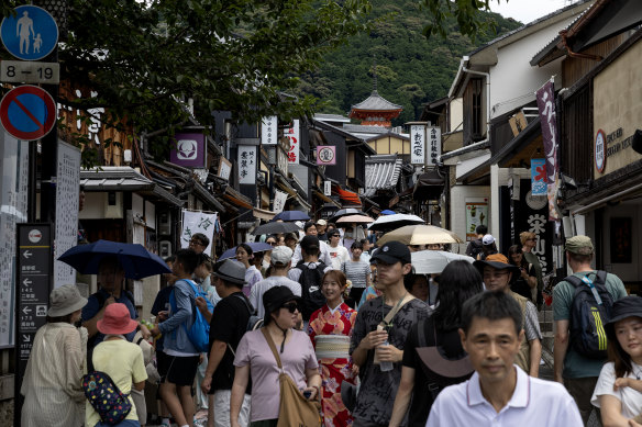 The ascent of the masses: Visitors walk the sloping streets to the Kiyomizu-dera Temple.