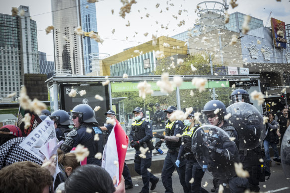 Police and protesters clash near a tram stop on Wednesday.