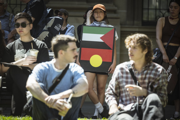 The Palestinian and Indigenous flags were on display at a pro-Palestinian protest in Melbourne on Sunday.