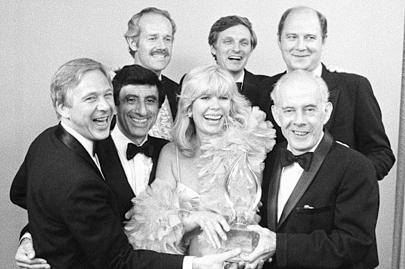 M.A.S.H stars (front row from left) William Christopher, Jamie Farr, Loretta Swit and Henry Morgan and (back row from left) Mike Farrell, Alan Alda and William Ogden Stiers with their People’s Choice Award for best comedy series in 1982.