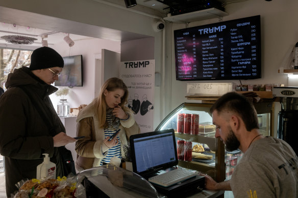 Customers order food at the Trump Pizza Station in Kyiv, Ukraine.