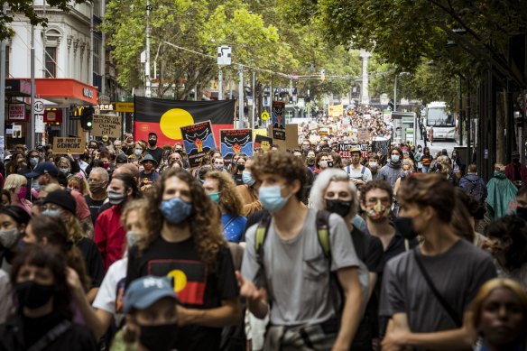 Thousands of protesters march through the city on Tuesday.