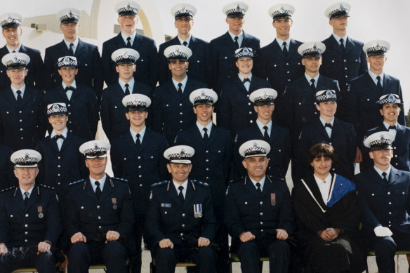 Michael Tarulli (second row from front, fourth from right) graduates as a police officer.