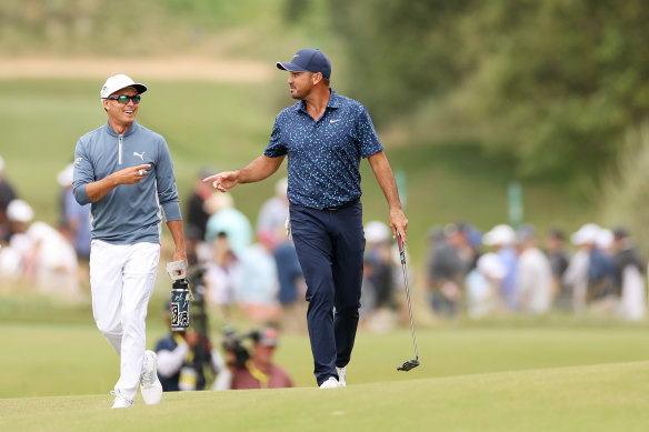 Rickie Fowler, left, playing alongside Australia’s Jason Day, carded 10 birdies in his opening round at the Los Angeles Country Club.