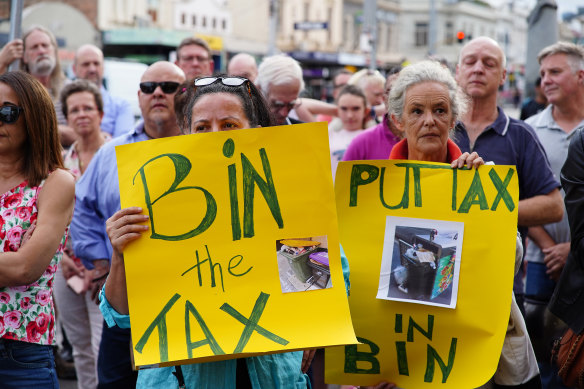 Residents rally outside Richmond Town Hall during a Yarra council meeting on the bin tax in March.