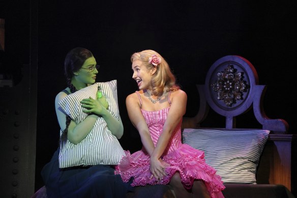 Opposites attract: Elphaba (Sheridan Adams) and Glinda (Courtney Monsma) in <i>Wicked</i>.