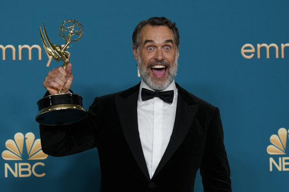 Murray Bartlett poses in the press room with the award for outstanding supporting actor in a limited anthology series or movie for The White Lotus.