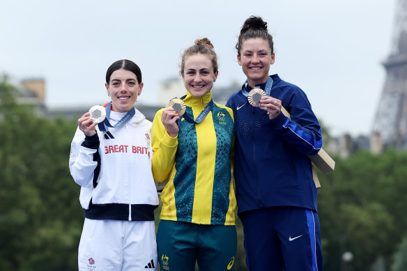 Gold medallist Grace Brown with her with silver medallist Anna Henderson Great Britain and bronze medallist Chloe Dygert of the United States.