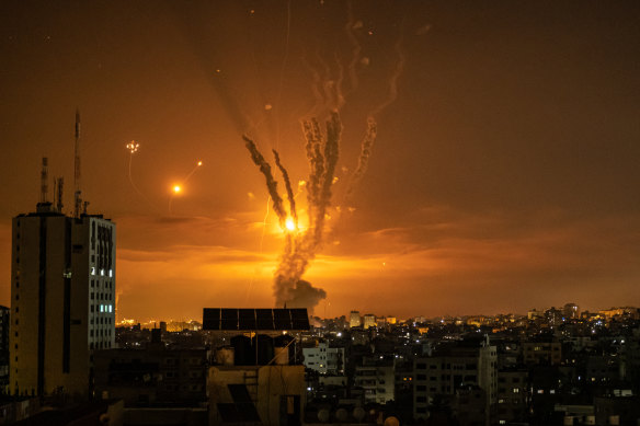 Rockets launched towards Israel from the northern Gaza Strip and response from the Israeli missile defence system streaks through the sky. 