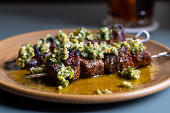 Paprika lamb skewer with a salsa verde of green olives, parsley and garlic.