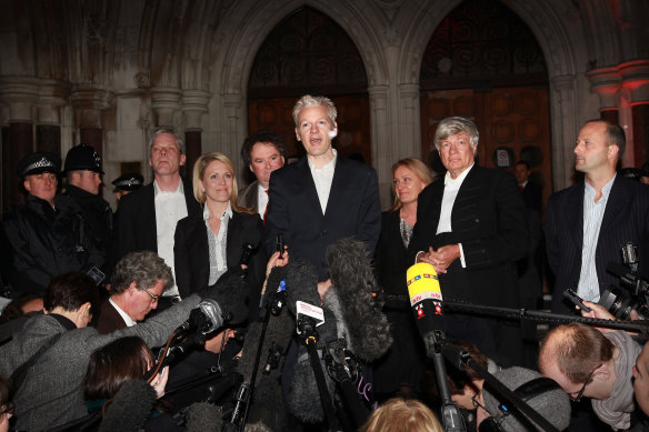 Robinson with Julian Assange, centre, after he was granted bail in 2010, and Geoffrey Robertson, second from right.