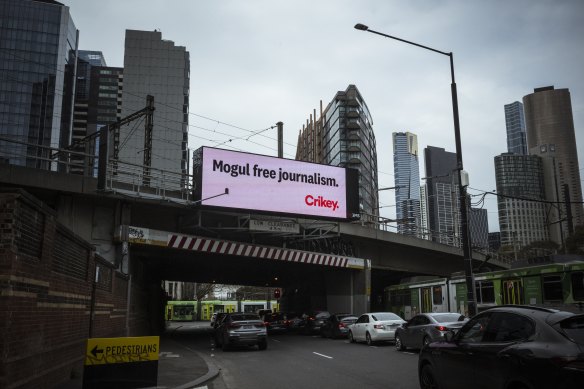 Crikey advertisement on the train bridge at Flinders and Spencer Streets in Melbourne on Friday.