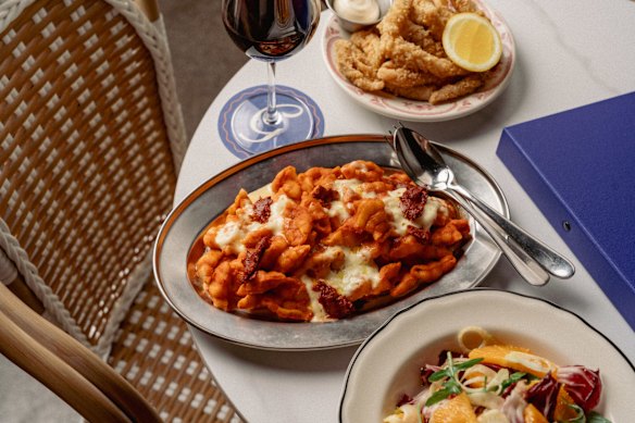 Baked vodka pasta and other dishes at Gambino’s rooftop bar.
