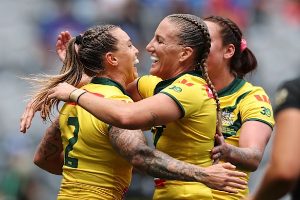 Jillaroos skipper Ali Brigginshaw congratulates tryscorer Julia Robinson.