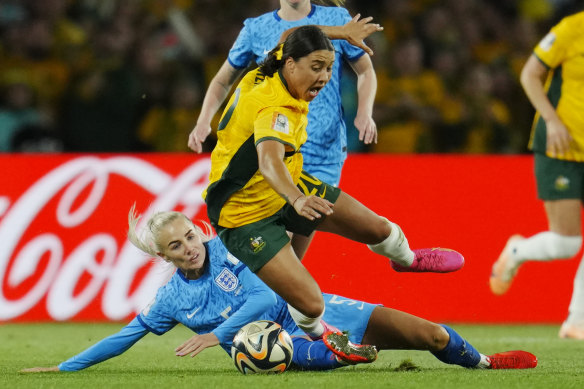 England’s Alex Greenwood tackles Sam Kerr for the ball.