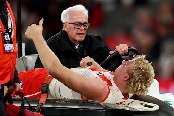Will Edwards was taken from the ground with a broken leg.