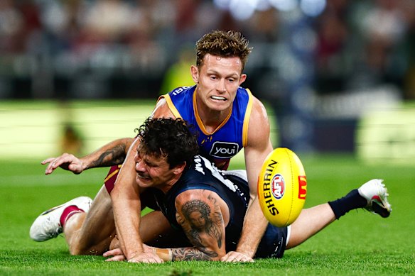 Lions defender Ryan Lester tackles Carlton’s Zac Williams in May.