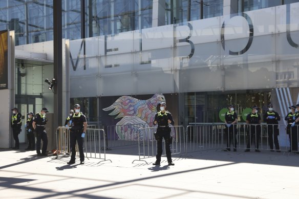 Police line the entrances of the vaccination hub at the Melbourne Museum.