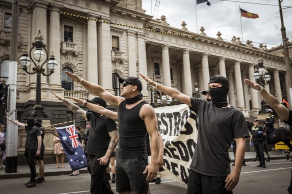 Neo-Nazis gathered outside Victorian parliament on Saturday following a speech by a British anti-trans rights campaigner.