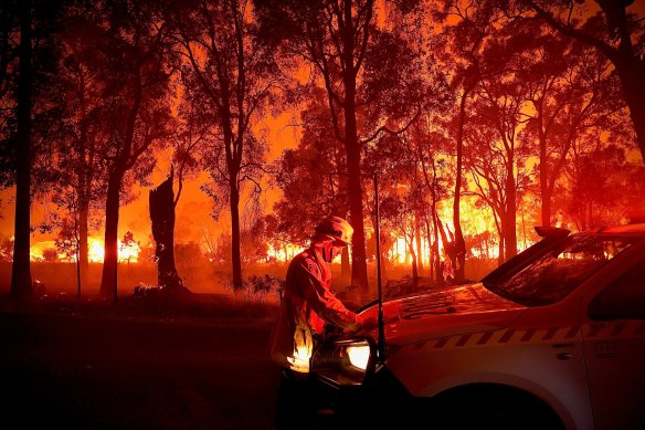The IPCC report is predicting a drastic rise in severe fire weather conditions. A firefighter takes a moment amid raging bushfires in WA last month.