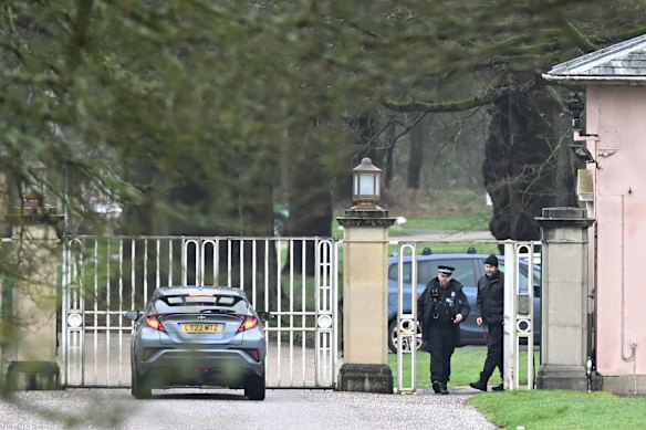 Police officers are stationed outside a vehicle approaches the gates of the Royal Lodge, Andrew Mountbatten-Windsor’s former residence.