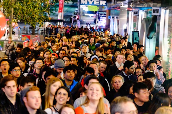 Crowds prepare to experience the rush of Boxing Day bargains.