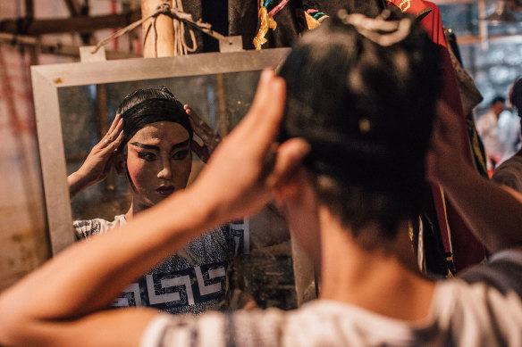 A performer prepares backstage at the Xiqu Centre.