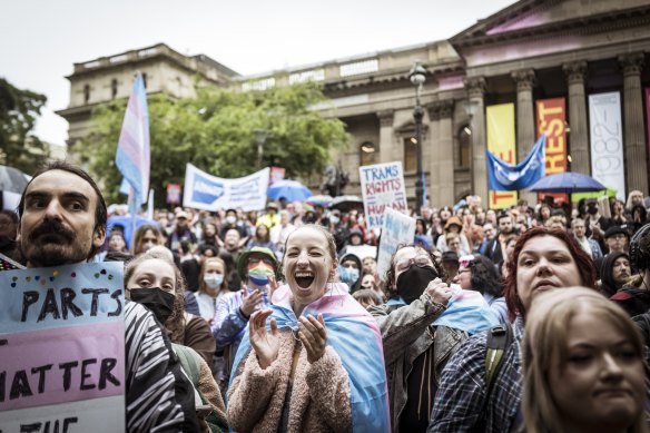 Transgender rights activists demonstrate outside the Victorian Parliament in 2022.