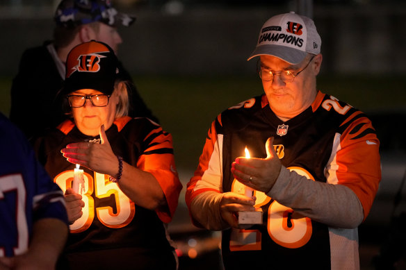 Fans gather for a vigil at the University of Cincinnati Medical Centre for injured football player Damar Hamlin of the Buffalo Bills.