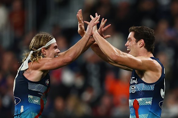 Bailey Smith celebrates a goal with Shannon Neale.