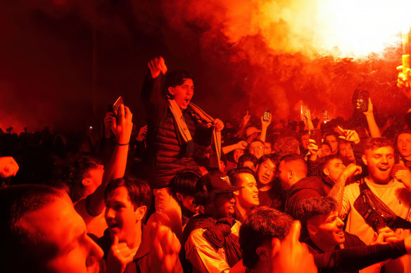 Australian soccer fans are seen  at Melbourne Federation Square on Thursday morning.