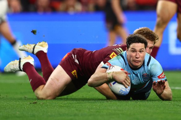 Halfback Mitchell Moses scores for NSW.