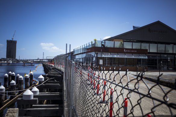 The fenced-off Central Pier at Docklands in 2021. 