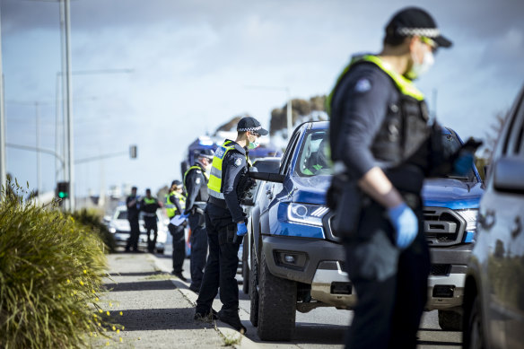 Police at a road stop on Somerton Road in Roxburgh Park on Thursday.