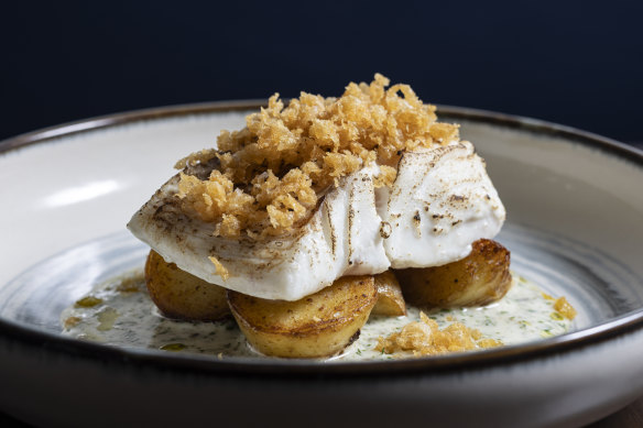 Cod fillet poached in butter topped with bits of beer batter.