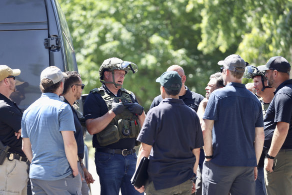 Law enforcement investigate the scene of a shooting in Provo, Utah. 