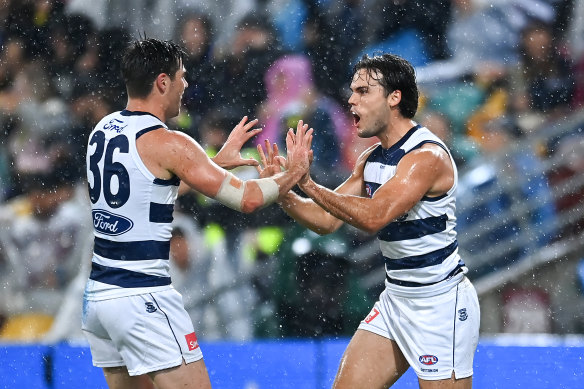 Geelong celebrate a goal.