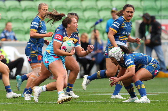 The Titans’ Evania Pelite braces for contact against the Eels on Saturday.